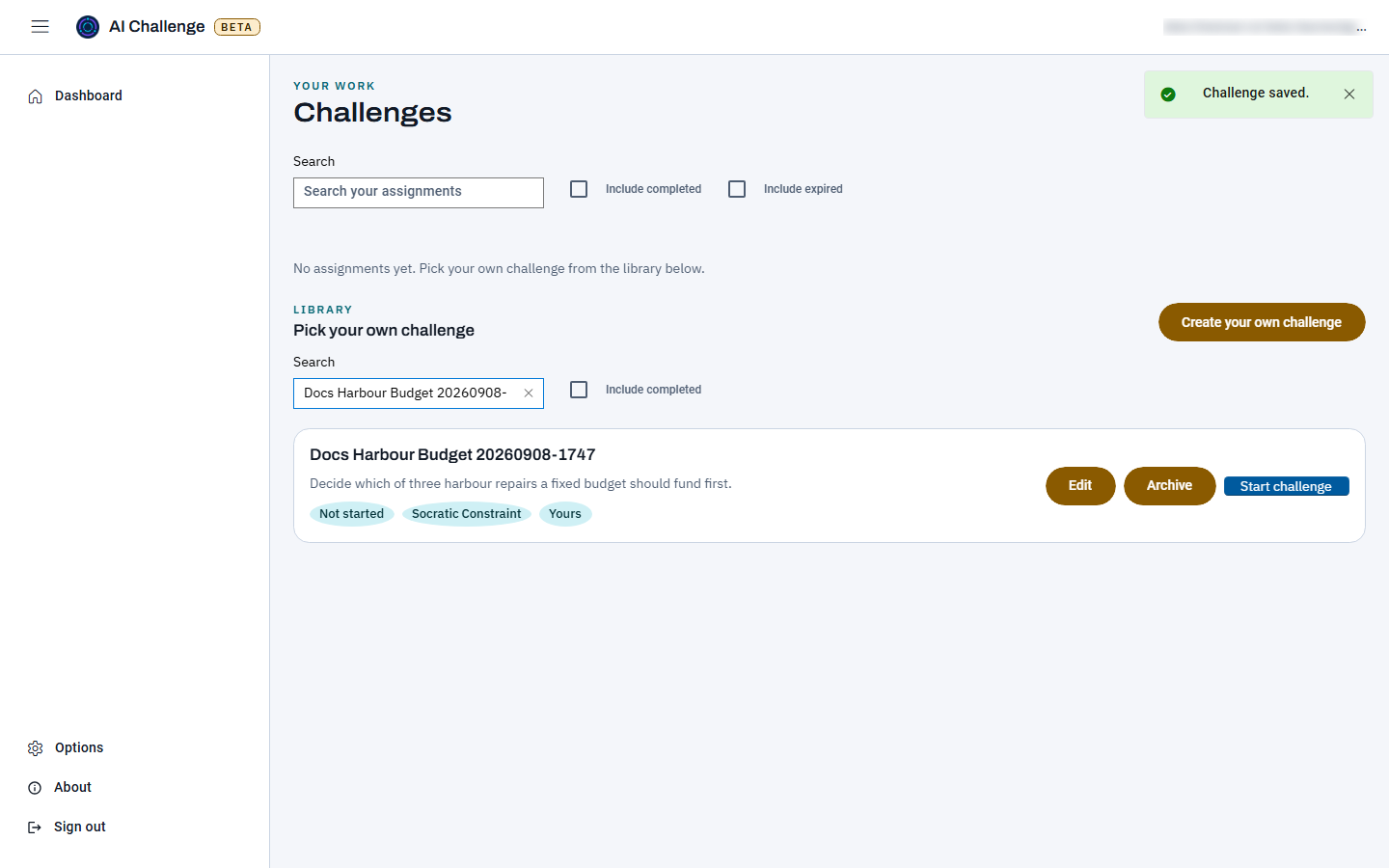 The dashboard just after saving, with a Challenge saved notice at the top right and the library search narrowed to one card carrying the learner's own challenge title and description, a Not started status, a Yours pill, and Edit, Archive and Start challenge buttons.
